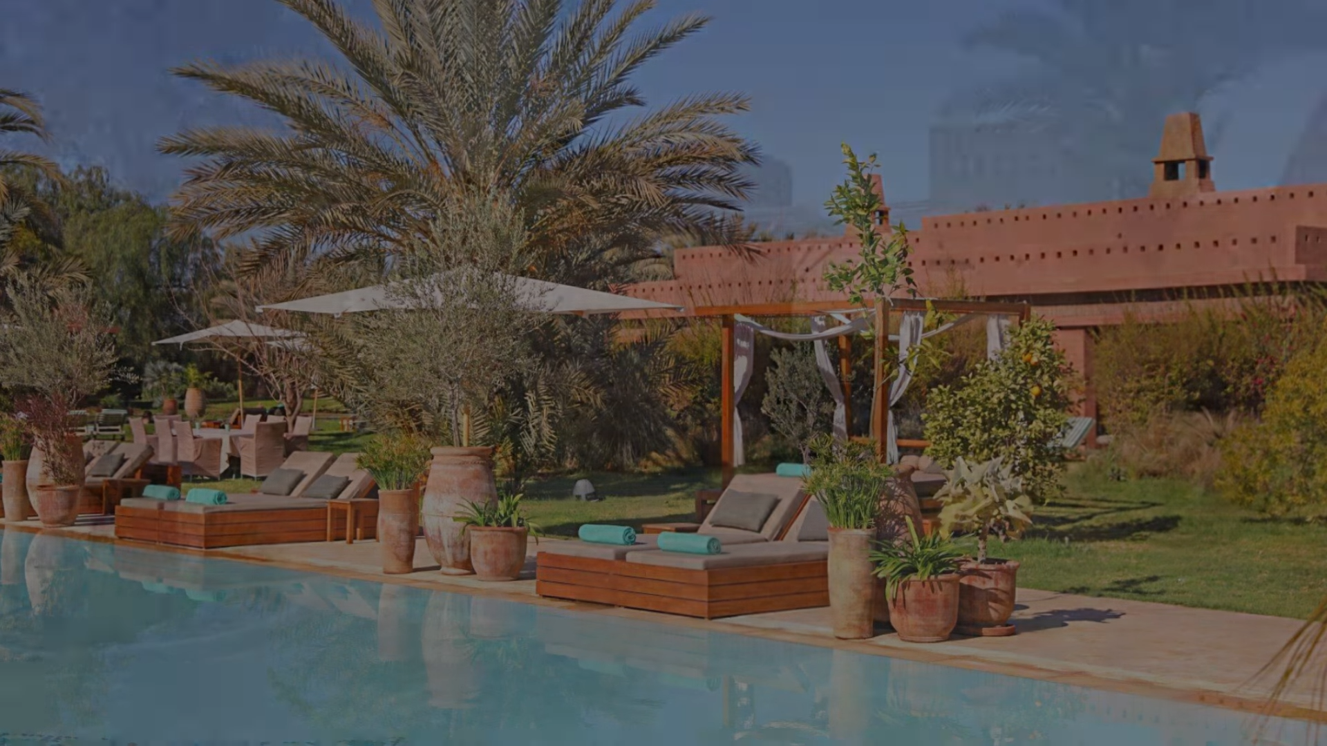 Elegant eco-friendly resort Le Domaine des Remparts near Marrakech, featuring traditional Moroccan décor, lush gardens, and panoramic views of the Atlas Mountains